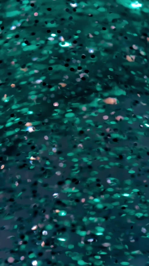 Sparkling Particles in Vertical 4K Slow Motion Turquoise Wallpaper Background Video stock 313359356