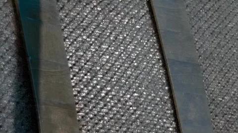 Sparkling in the rays of the sun, the waterfall flows down a vertical wall  Stock Footage 323923005