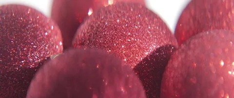 Sparkling red sequins on bauble surface 4K scope slding video Stock Footage 316945408