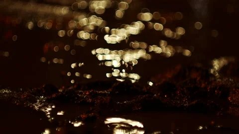 Sparkling reflection of the light of the night city in a dirty puddle. Stock Footage 270365382