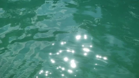 The sparkling ripples of the turquoise river surface Stock Footage 321321493