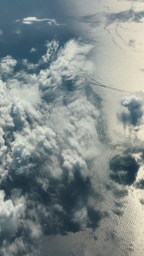 Sparkling sea surface with sun flare and cloudscape texture background Stock Footage 341768268