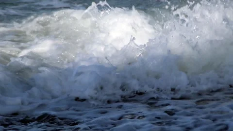 Sparkling sea waves crash hard Stock Footage 321008992