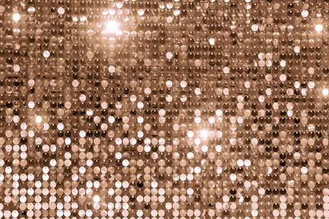 Sparkling sequin texture in warm brown hues for festive designs Stock Photos