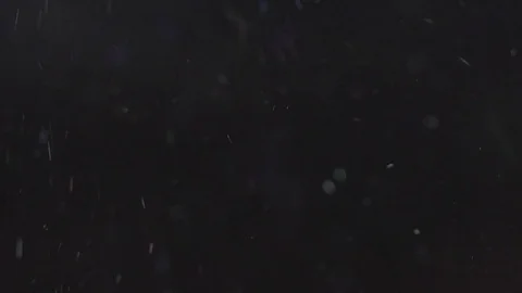 Sparkling shimmer flying on the black background, abstract slow motion Video stock 75972850