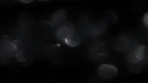 Sparkling silver bokeh leak reflection on black video Vidéo 318060141