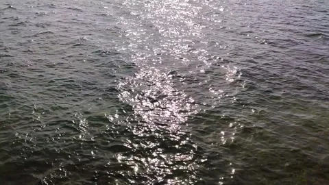 Sparkling Sunlight Reflection on Sea Water Ripples Stock Footage 343176907