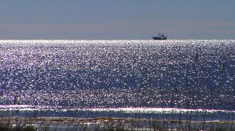  Sparkling water, breaking waves, shrimp boat Stock Footage 57702006
