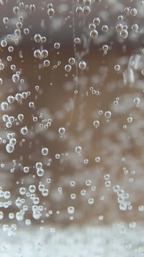 Sparkling water bubbles rising macro ASMR video Stock Footage 312359672