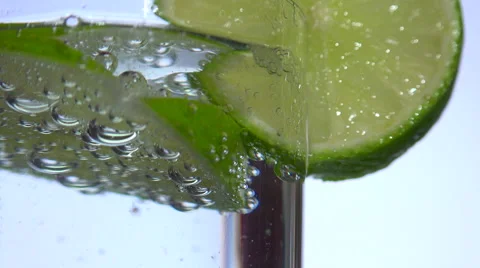 Sparkling water  bubbles under slice of lemon Stock Footage 55188590