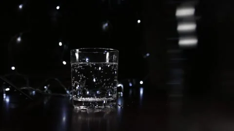 Sparkling water in the glass bubbles. Stock Footage 144455657