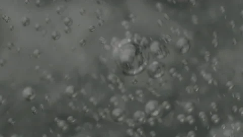 Sparkling water in the glass bubbles going up slow-mo motion Stock Footage 159761615
