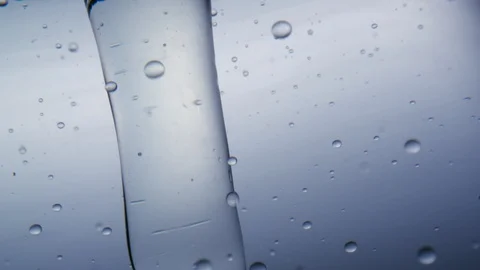 Sparkling water moving in vortex in front of white background Stock Footage 98946829
