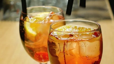 Sparkling water over ice, lemon and cherry. 動画素材 71246728