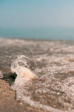 Sparkling Wave on Sand Stock Photos