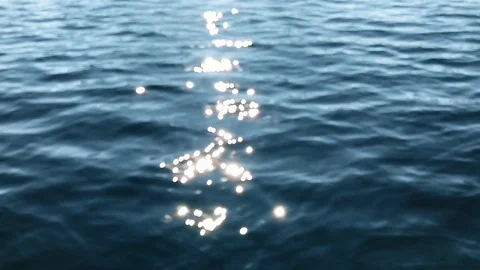 Sparkling wavy water is shining on a sunny summer day Stock Footage