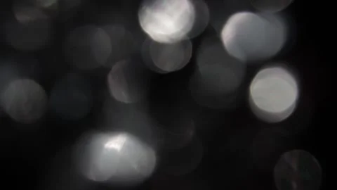 Sparkling white bokeh in the dark Video stock 318126507