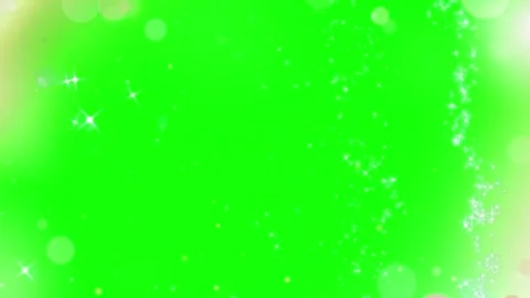 Sparkling white particle stream flowing vertically against vibrant green screen Stock Footage 345215533