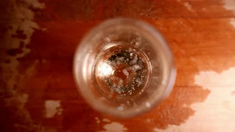 Sparkling wine bubbles rise in a flute glass (top view). POV: champagne glass 스톡 동영상 345941151