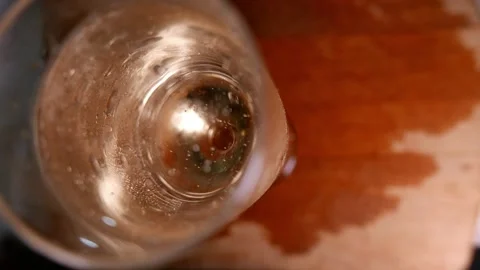 Sparkling wine bubbles rising in a glass (top view, close-up). A champagne glass 스톡 동영상 344620592