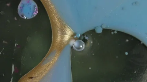 Sparkly Blue Liquid Draining Stock Footage 74774229