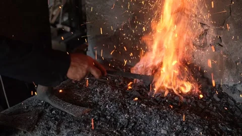 Sparks And Flame Burst From Blacksmith Furnace, Stock Footage 324567280