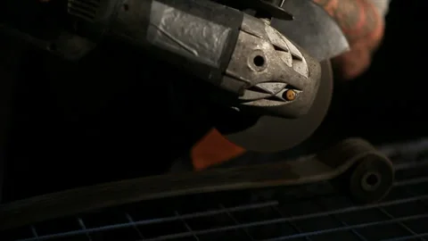 Sparks from the angle drive grinder against a dark background Stock Footage 115990863