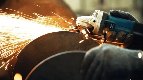 Sparks from the angle grinder fly in different directions Vídeos de archivo 112433290