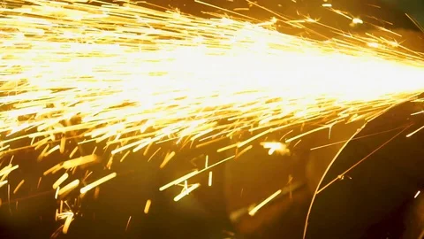 Sparks from the angle grinder fly in different directions Vídeos de archivo 112436246