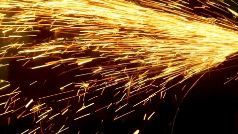 Sparks from the angle grinder fly in different directions Vídeos de archivo 112436934