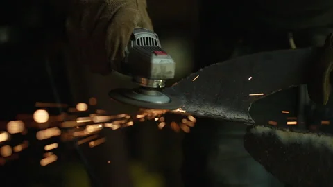 Sparks Being Thrown in Slow Motion by Metalsmith Video stock 243204416