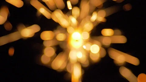 The sparks from the bengal lights on the dark background. slow motion Stock Footage 80986455