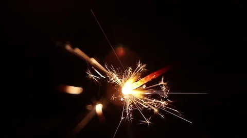 Sparks from a burning sparkler close-up 4 Stock Footage