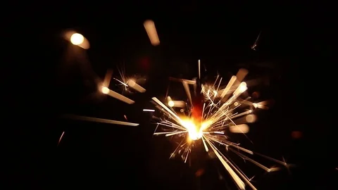 Sparks from a burning sparkler close-up Stock Footage