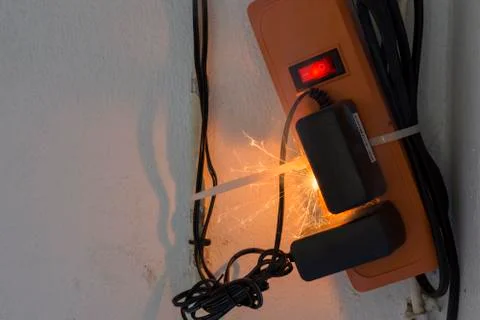 Sparks caused by electric shock, old appliances Substandard power plugs cause Stock Photos