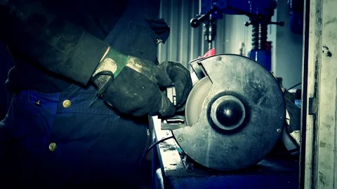 Sparks come out from grinding wheel. Mechanic polish brake pads. Stock Footage