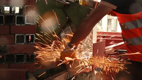 Sparks from the cutting of iron at the construction site Stock Footage 159054100