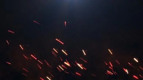 The sparks on a dark background Stock Illustration