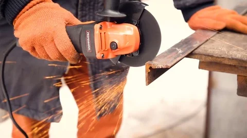 Sparks during the cutting of metal by an angle grinder. Stock Footage 74871800