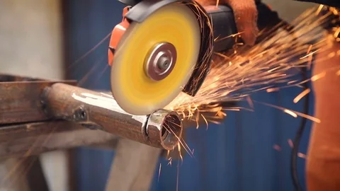 Sparks during the cutting of metal by an angle grinder. Stock Footage 74871860