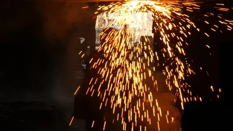 Sparks fall down, the fire bursts out of the gas burner Stock Footage 87505923
