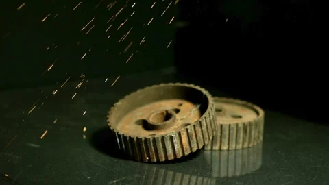 Sparks fall over old rusty industrial gears Stock Footage 327123404