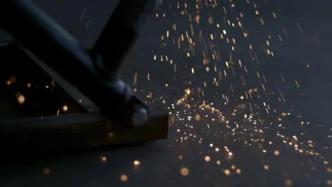 Sparks falling from welding tool Stock Photos