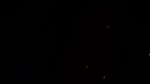 Sparks fire cracks in grill fire pit. Burning ash rise from large fire in the Video stock 73791470