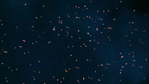 Sparks of fire on a dark background, burning yellow sparks in the night. Screen Stock Footage 279682087