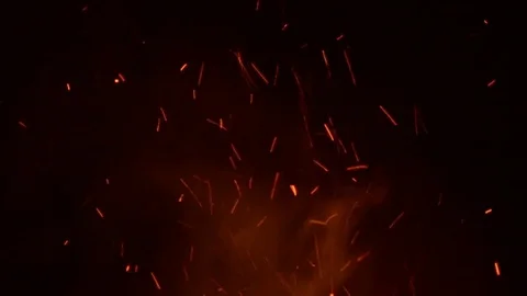 Sparks from fire on a dark background Stock Footage