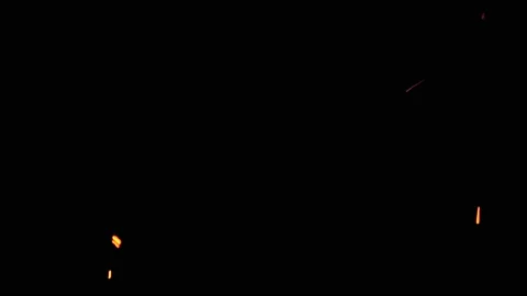 Sparks from fire flying from large fire in night on black background. Stock Footage 155968000