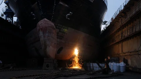 Sparks fly from the bow of the ship to the dock Stock Footage 87588685