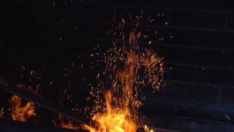 Sparks fly from fire on a dark background  slow motion Stock-Footage 160069606