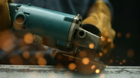 Sparks fly from industrial grinder, super slow motion Stock Footage